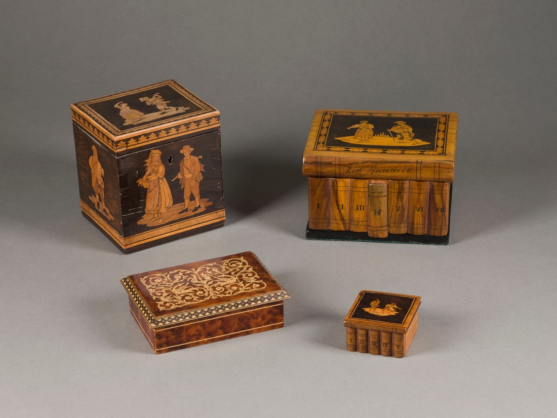 | KONVOLUT AUS VIER INTARSIERTEN SCHATULLEN: KONVOLUT AUS VIER INTARSIERTEN SCHATULLEN Teilw. wohl Italien, 1. H. 20. Jh. Verschiedene Hölzer, part. ebonisiert und intarsiert, Metall, teilw. mit Schlüssel. 13 x 11,5 x 10,5 cm / 9,5 x 15 x