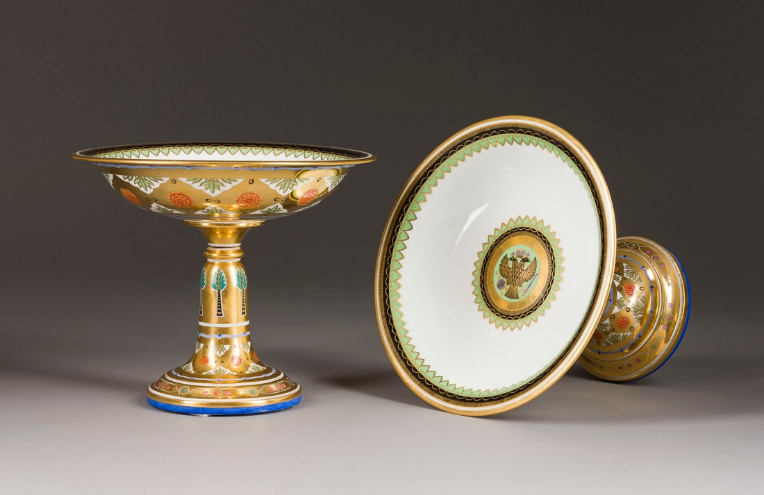 | PAAR TAZZEN AUS DEM KREML-SERVICE: A PAIR OF PORCELAIN TAZZAS FROM THE KREMLIN SERVICE Russian, St. Petersburg, Imperial Porcelain Factory, Period of Alexander II, 1855-1881 1855-1881 Painted, gilded, decorated with a black imperial