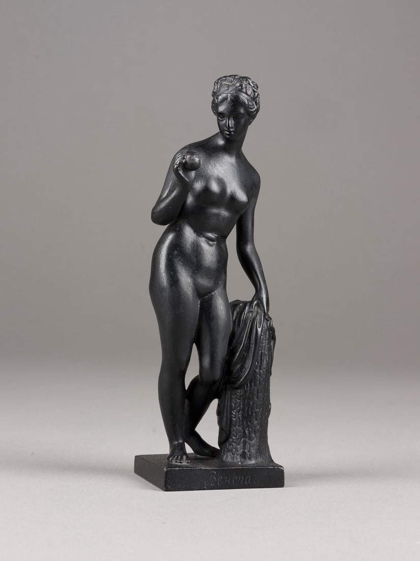 | VENUS: AN IRON FIGURE OF VENUS Russian, Kasli Foundry, P. Trofimov, 1911 Realistically cast. Titled in Cyrillic on the base, on the bottom dated foundry mark with a double-headed eagle and a caster´s mark.