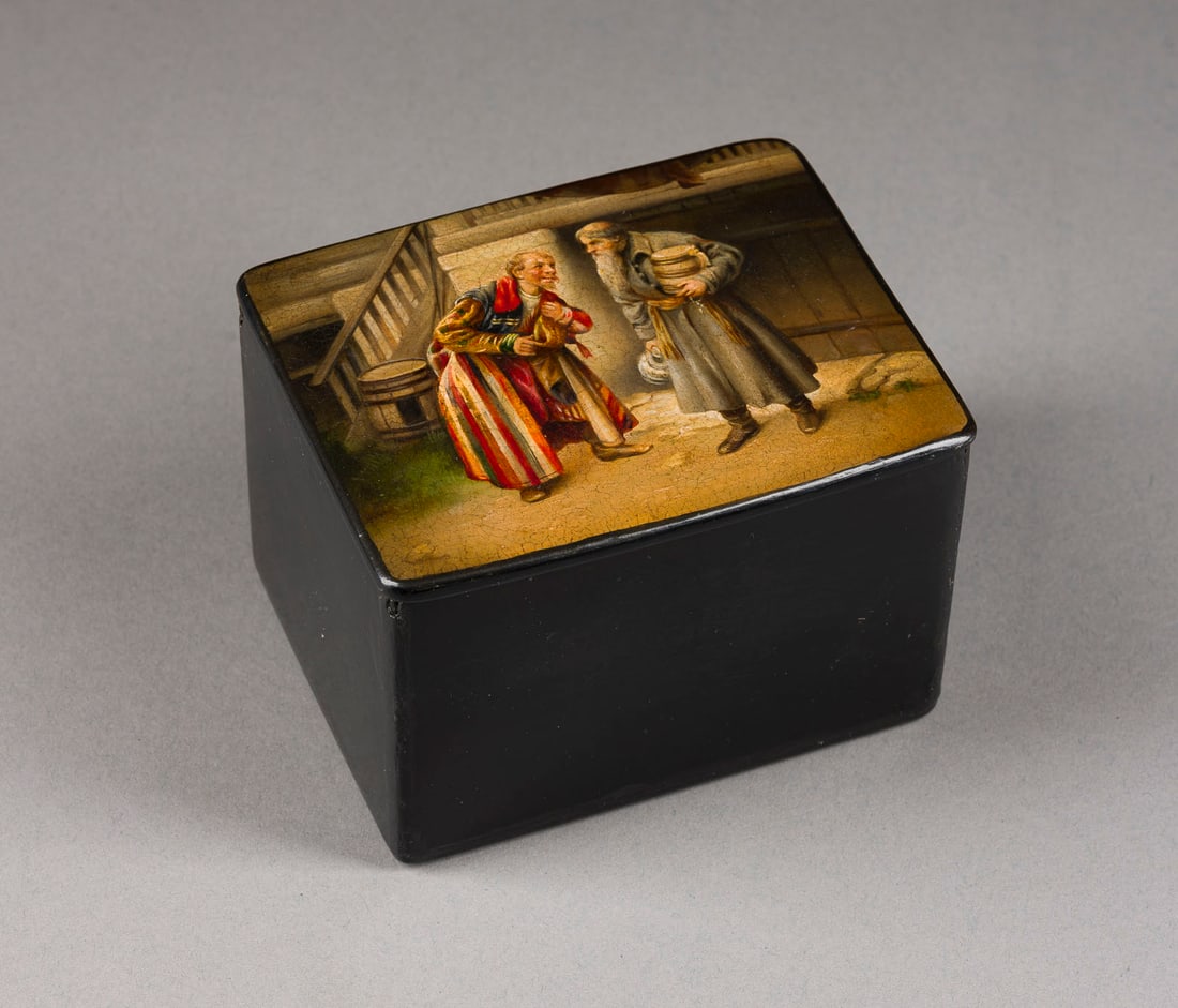 | LACKDOSE 'FREUNDE' (NACH K.W. LEBEDEW): A PAPIER-MACHE AND LACQUER BOX 'FRIENDS' (AFTER K.V. LEBEDEV) Russian, Ostashkovo, Vishnyakov and Sons Factory, 1882-1888 Painted, of rectangular form. Marked inside the lid with three firm´s