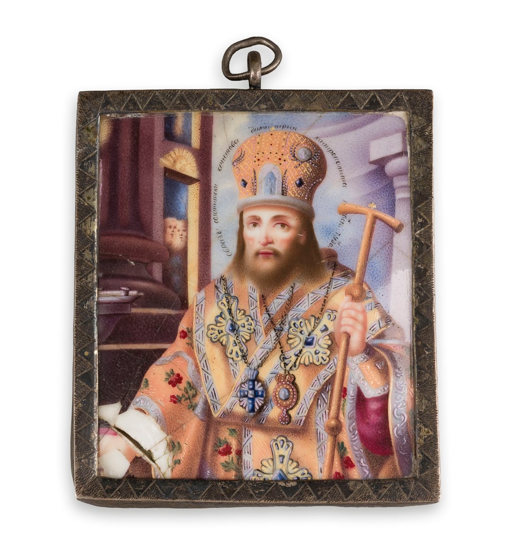 | GROSSES FINIFT MIT DEM HEILIGEN DMITRIJ VON ROSTOW: A LARGE ENAMEL PENDANT ICON (FINIFT) OF ST. DMITRI METROPOLITAN OF ROSTOV Russian, Rostov, 18th century Enamelled on copper. Metal-mounted. Damages to the enamel. 8.3 x 7.2 cm.GROSSES FINIFT MIT DEM H