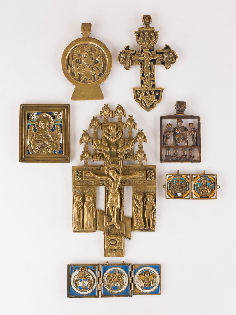 | SAMMLUNG VON SIEBEN BRONZE-IKONEN: DARSTELLUGEN CHRISTI UND DER GOTTESMUTTER SOWIE: A COLLECTION OF SEVEN BRASS ICONS DEPICTING IMAGES OF CHRIST AND THE MOTHER OF GOD AS WELL AS OLD TESTAMENT TRINITY Russian, 16th-19th century Cast in relief, partially multi-coloured enamelled.