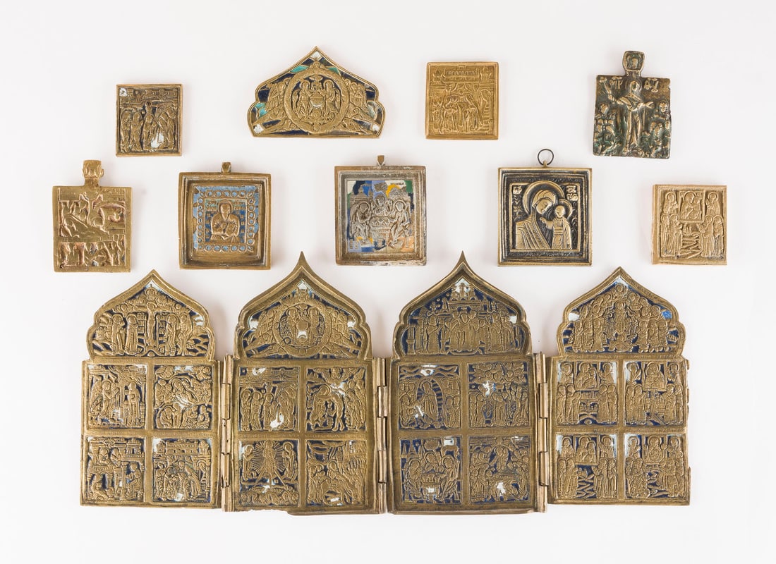 | SAMMLUNG VON ZEHN BRONZE-IKONEN: DARSTELLUNGEN DER GOTTESMUTTER, HEILIGER ANTIPAS SOWIE FESTTAGE: A COLLECTION OF TEN BRASS ICONS DEPICTING IMAGES OF THE MOTHER OF GOD, ST. ANTIPAS AND LITURGICAL FEASTS Russian, 16th-20th century Cast in relief, partially multi-coloured enamelled. Enamel part. chi