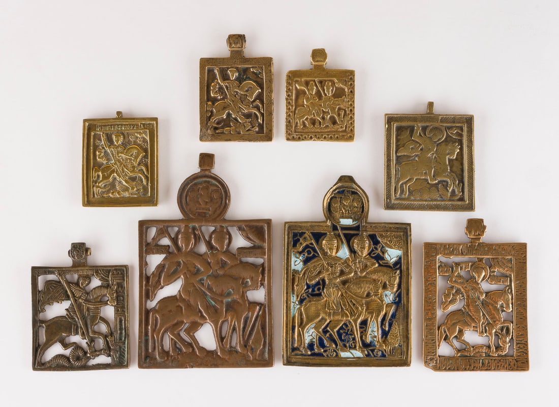 | SAMMLUNG VON ACHT BRONZE-IKONEN: HEILIGE BORIS UND GLEB SOWIE HEILIGER GEORG DER DRACHENTOeTER: A COLLECTION OF EIGHT BRASS ICONS DEPICTING STS. BORIS AND GLEB AS WELL AS ST. GEORGE KILLING THE DRAGON Russian, 17th-19th century Cast in relief, partially enamelled in blue and white. Enamel min. c