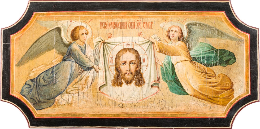| GROSSFORMATIGE IKONE MIT DEM MADYLION AUS EINER KIRCHEN-IKONOSTASE: A LARGE ICON SHOWING THE MANDYLION FROM A CHURCH ICONOSTASIS Russian, 19th century Oil on wood panel with kovcheg. The border made of gold. Restorations. 30.2 x 60.7 cm.GROSSFORMATIGE IKONE MIT DEM MA