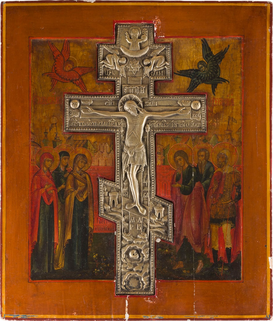 | GROSSE STAUROTHEK MIT DER KREUZIGUNG CHRISTI: A LARGE STAUROTHEK ICON SHOWING THE CRUCIFIXION OF CHRIST Russian, 19th century Tempera on wood panel with kovcheg. The background made of silver, covered by a golden lacquer. A brass crucifix inserte