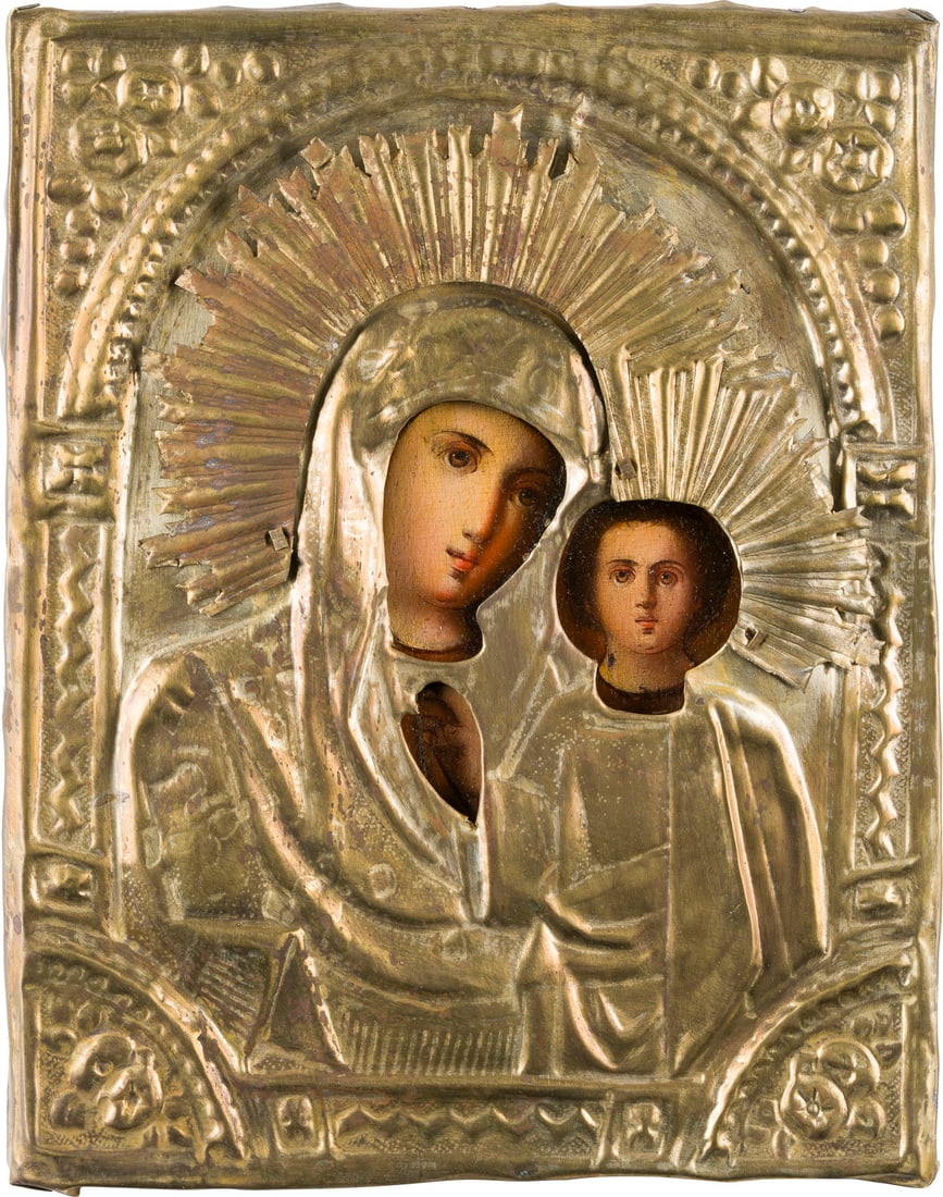 | KLEINE IKONE MIT DER GOTTESMUTTER VON KASAN (KASANSKAJA) MIT OKLAD: A SMALL ICON SHOWING THE KAZANSKAYA MOTHER OF GOD WITH OKLAD Russian, 19th century Oil on wood panel with velvet backing. The brass oklad chased and repousse. 22.2 x 17.7 cm.KLEINE IKONE MIT DER GOTTE