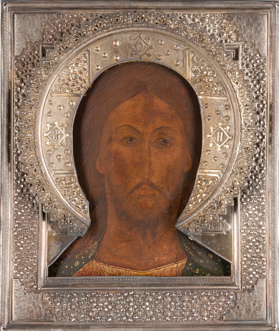 | SEHR FEINE IKONE MIT CHRISTUS 'DAS GRIMME AUGE' MIT SILBER-RIZA: A VERY FINE ICON OF THE SAVIOUR WITH THE FEARSOME EYE WITH SILVER RIZA Russian, 16th century (icon), Russian, Moscow, 1896 (riza) Tempera on wood panel with kovcheg. Christ is portrayed solemnly, his