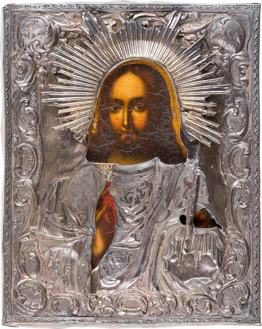 | KLEINE IKONE MIT CHRISTUS DEM WELTENHERRSCHER MIT SILBER-OKLAD: A SMALL ICON SHOWING CHRIST THE SAVIOUR WITH SILVER OKLAD Russian, mid 19th century (icon), Russian, St. Petersburg, Trophim Semenov Bogdanov, 1851 (oklad) Oil on wood panel with velvet backing. The s