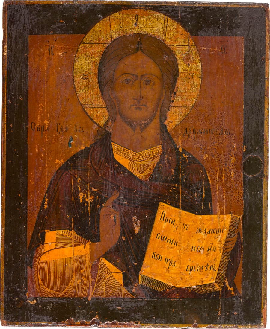 | IKONE MIT CHRISTUS PANTOKRATOR: AN ICON SHOWING CHRIST PANTOKRATOR Russian, 19th century Tempera on wood panel. The halo made of silver, covered by a golden lacquer. Losses, partially restored. 35.6 x 29.2 cm.IKONE MIT CHRISTUS PANT