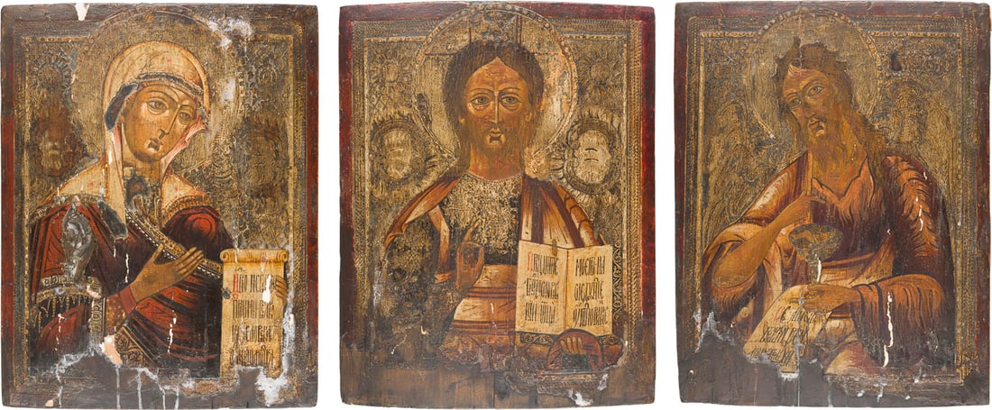 | GROSSE DREITEILIGE DEESIS: CHRISTUS PANTOKRATOR FLANKIERT VON DER GOTTESMUTTER UND JOHANNES DME: THREE PANELS FORMING A DEISIS: CHRIST PANTOKRATOR FLANKED BY THE MOTHER OF GOD AND ST. JOHN THE FORERUNNER Russian, 18th century Tempera on wood panels. The background made of silver, covered by a gol