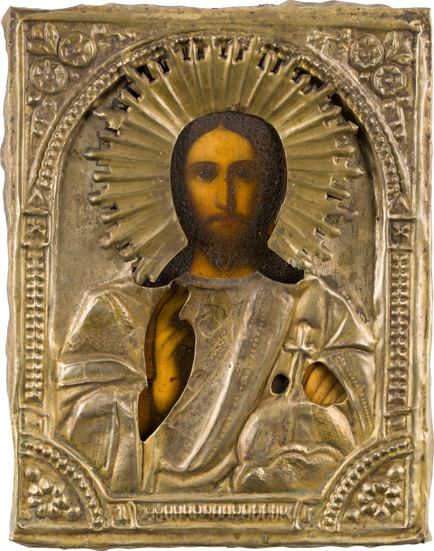 | KLEINE IKONE MIT CHRISTUS DEM WELTENHERRSCHER MIT OKLAD: A SMALL ICON SHOWING CHRIST THE SAVIOUR WITH OKLAD Russian, 19th century Oil on wood panel. The brass oklad chased and repousse. 22 x 17.3 cm.KLEINE IKONE MIT CHRISTUS DEM WELTENHERRSCHER MIT OKLAD Ru