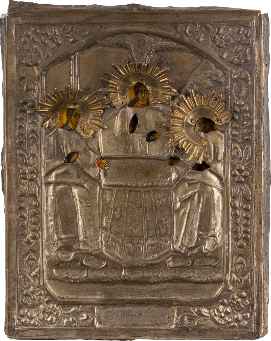 | IKONE MIT DER ALTTESTAMENTLICHEN DREIFALTIGKEIT MIT OKLAD: AN ICON SHOWING THE OLD TESTAMENT TRINITY WITH OKLAD Russian, 19th century Tempera on wood panel. The brass oklad chased and repousse. Damages to the oklad. 28.3 x 22.6 cm.IKONE MIT DER ALTTESTAMENTLI