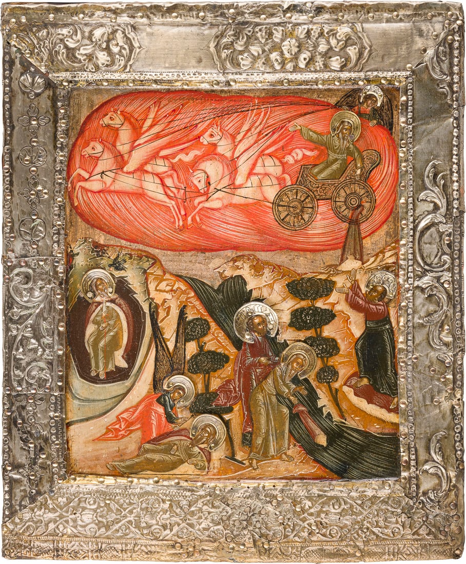 | IKONE MIT DEM PROPHETEN ELIAS, SEINEM LEBEN IN DER WUeSTE UND SEINER FEURIGEN HIMMELFAHRT MIT: AN ICON DEPICINTG EPISODES FROM THE LIFE OF THE PROPHET ELIJAH IN THE DESERT AND HIS FIERY ASCENT TO HEAVEN WITH SILVER BASMA Russian, 18th century Tempera on wood panel. The borders overlaid with a s