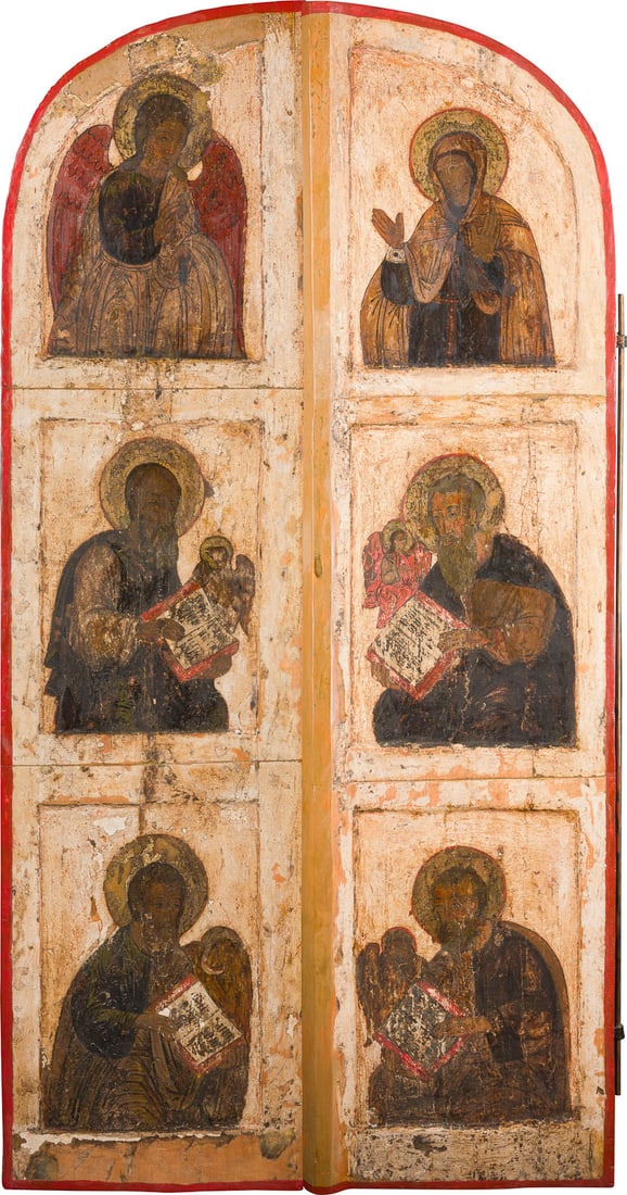 | MONUMENTALE KOeNIGSTUeR AUS EINER KIRCHEN-IKONOSTASE: A MONUMENTAL PAIR OF ROYAL DOORS FROM A CHURCH ICONOSTASIS Russian, 17th century Tempera on wood panels with kovcheg. The upper part showing the Annunciation, the lower section depicting the four evan
