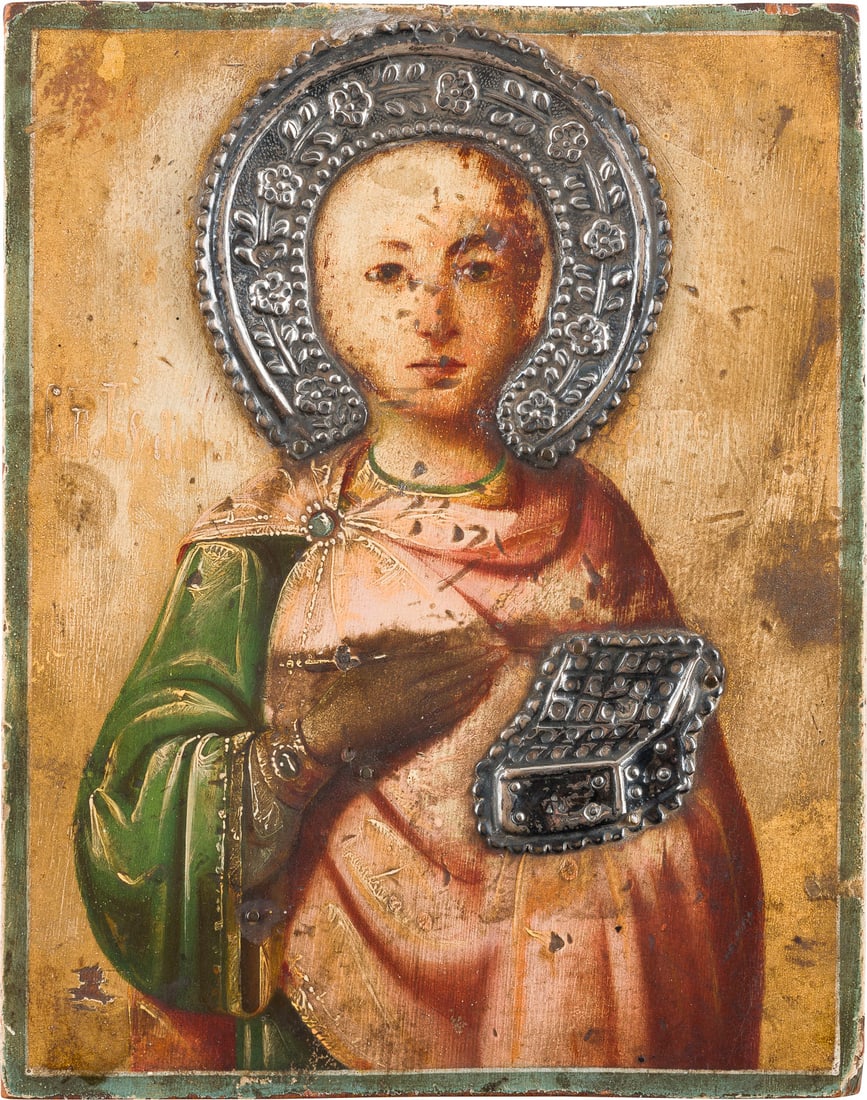 | KLEINE IKONE MIT DEM HEILIGEN PANTELEIMON: A SMALL ICON SHOWING ST. PANTELEIMON Mount Athos, circa 1900 Oil on wood panel. Traces of gilding. Applied silver halo and medicine box. Wearings. On the reverse Cyrillic stamp. 17.6 x 13.9 cm.KLEINE