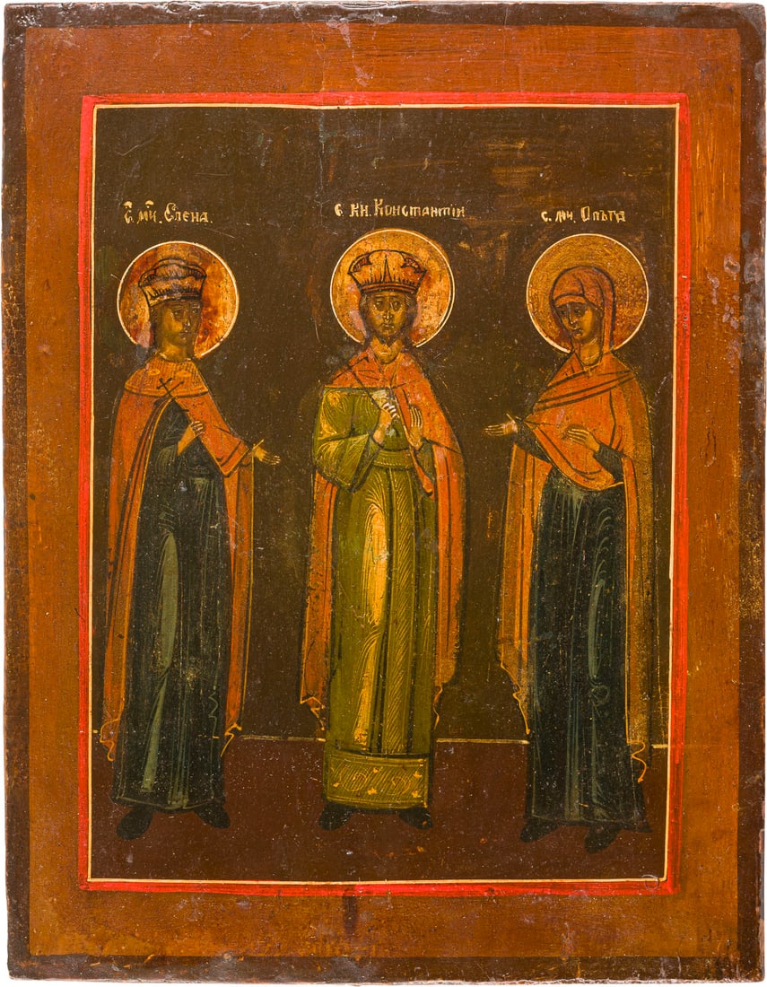 | IKONE MIT DEM HEILIGEN KONSTANTIN FLANKIERT VON HELENA UND OLGA: AN ICON SHOWING ST. CONSTANTINE FLANKED BY STS. HELENA AND OLGA Russian, 19th century Tempera on wood panel. The haloes made of silver, covered by a golden lacquer. Partially restored. 31.2 x 24 cm.IK