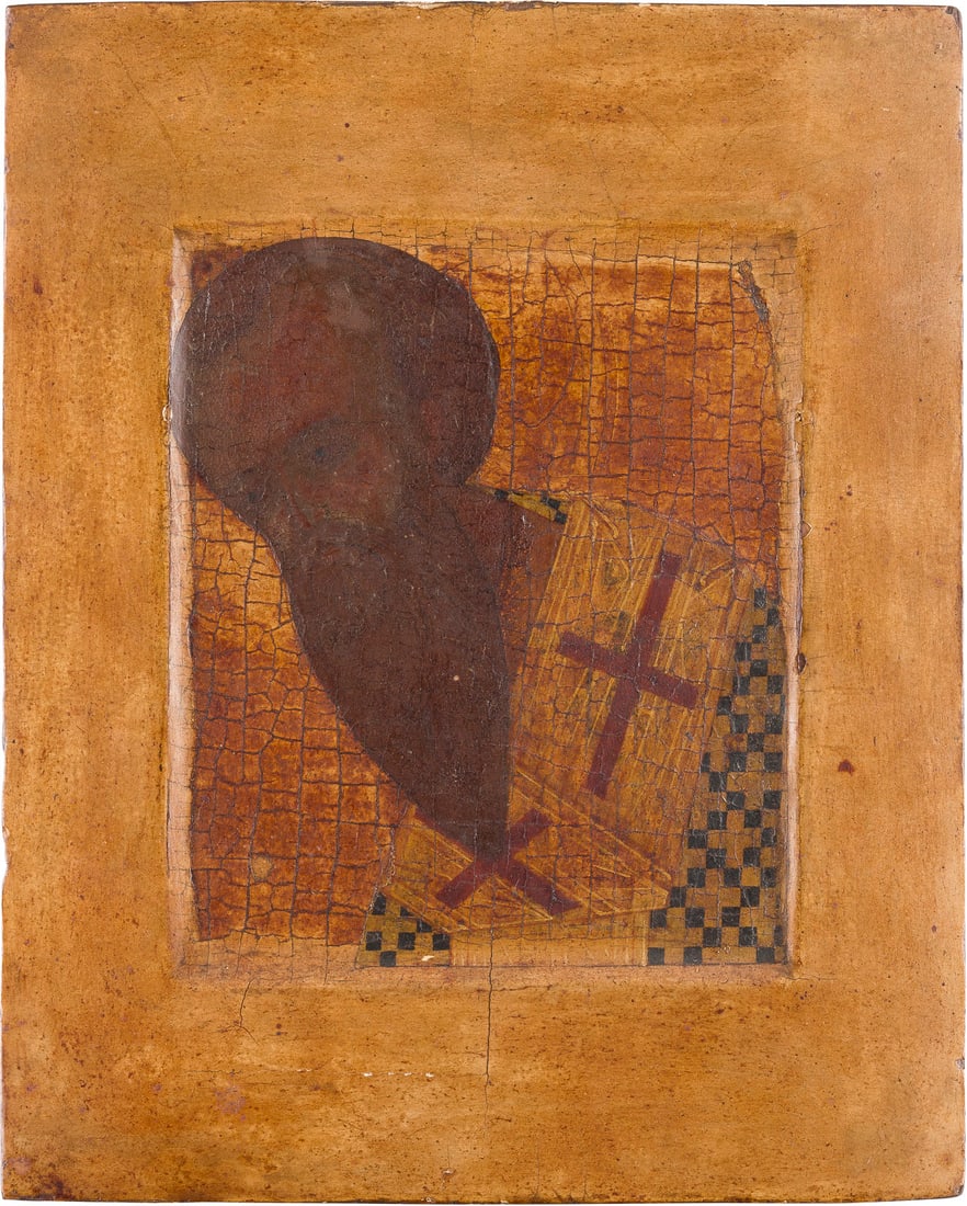 | MUSEALE IKONE MIT DEM HEILIGEN BASILIUS DEM GROSSEN: AN IMPORTANT ICON SHOWING ST. BASIL THE GREAT Russian, circa 1500 Tempera on wood panel with kovcheg. The saint is depicted in precious bishop's garments with striking geometric ornament of crosses. I