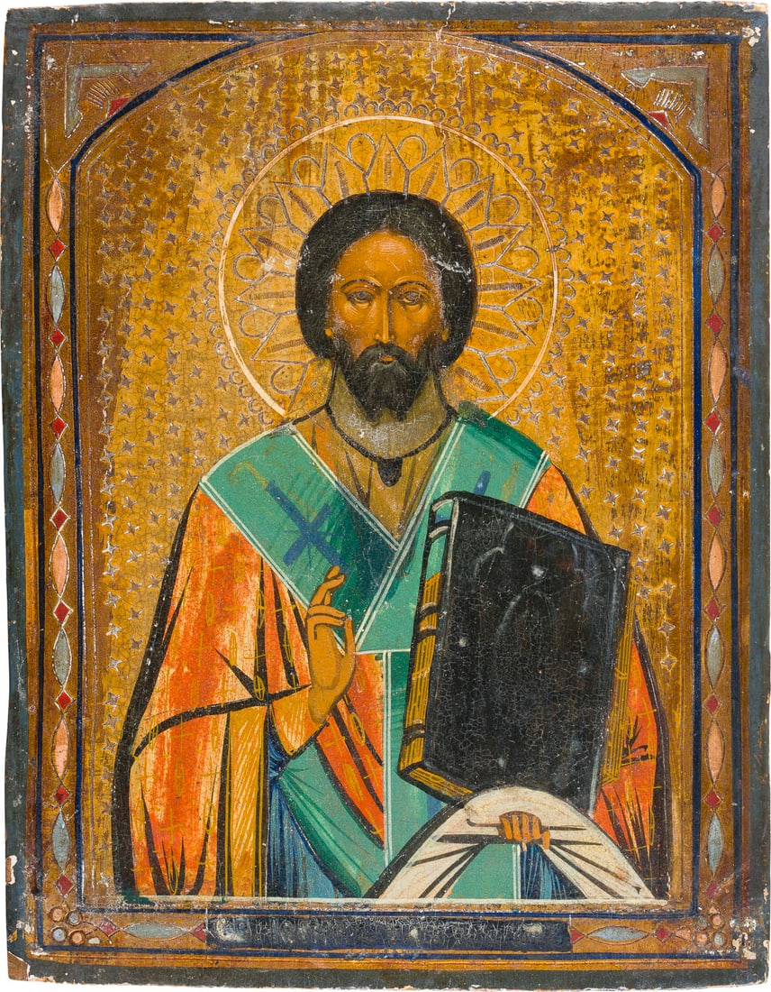 | KLEINE IKONE MIT DEM HEILIGEN JOHANNES CHRYSOSTOMUS: A SMALL ICON SHOWING ST. JOHN CHRYSOSTOM Russian, late 19th century Tempera on wood panel. The background made of silver, covered by a golden lacquer. The background ornately incised. The borders orna