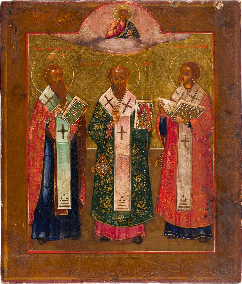 | IKONE MIT DEN DREI HIERARCHEN BASILIUS DEM GROSSEN, GREGOR DEM THEOLOGEN UND JOHANNES CHRYSOSTOMUS: AN ICON SHOWING THE THREE GREAT HIERARCHS STS. BASIL THE GREAT, GREGORY THE THEOLOGIAN AND JOHN CHRYSOSTOM Russian, 19th century Tempera on wood panel, on gold ground. Minor losses. 31.1 x 26.4 cm.IKO