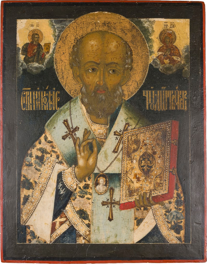 | GROSSFORMATIGE UND FEINE IKONE MIT DEM HEILIGEN NIKOLAUS VON MYRA: A LARGE AND FINE ICON SHOWING ST. NICHOLAS OF MYRA Russian, Follower of Simon Uhsakov, circa 1700 Tempera on wood panel. The halo and the garments made of gold. Laid down on a later panel, areas of re
