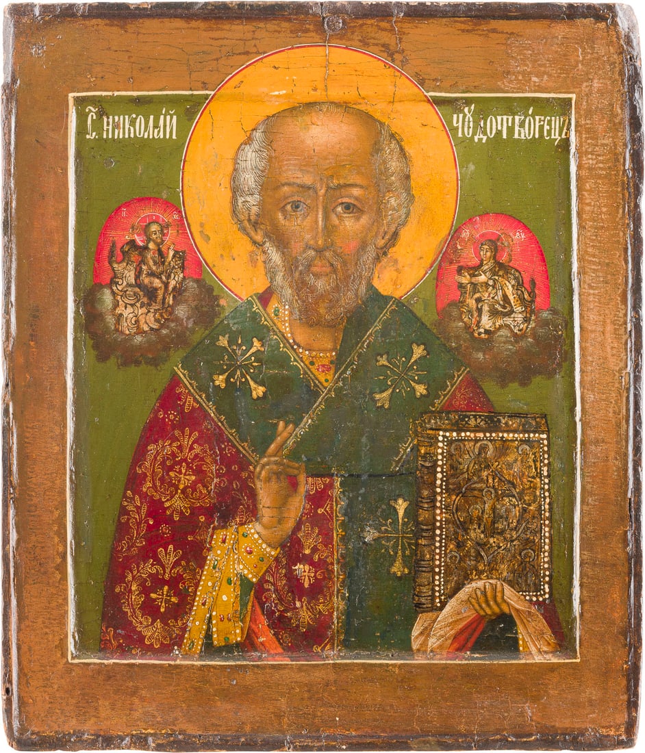 | IKONE MIT DEM HEILIGEN NIKOLAUS VON MYRA: AN ICON SHOWING ST. NICHOLAS OF MYRA Russian, 18th century Tempera on wood panel with double kovcheg. The garments made of silver and gold. Partially restored. 31.2 x 26.5 cm.IKONE MIT DEM HEILIGEN NI