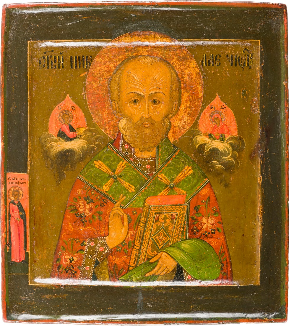 | IKONE MIT DEM HEILIGEN NIKOLAUS VON MYRA: AN ICON SHOWING ST. NICHOLAS OF MYRA Russian, Kostroma, last quarter of the 17th century Tempera on wood panel with double kovcheg. St. Boniface represented on the left border. Partially restored. 30.