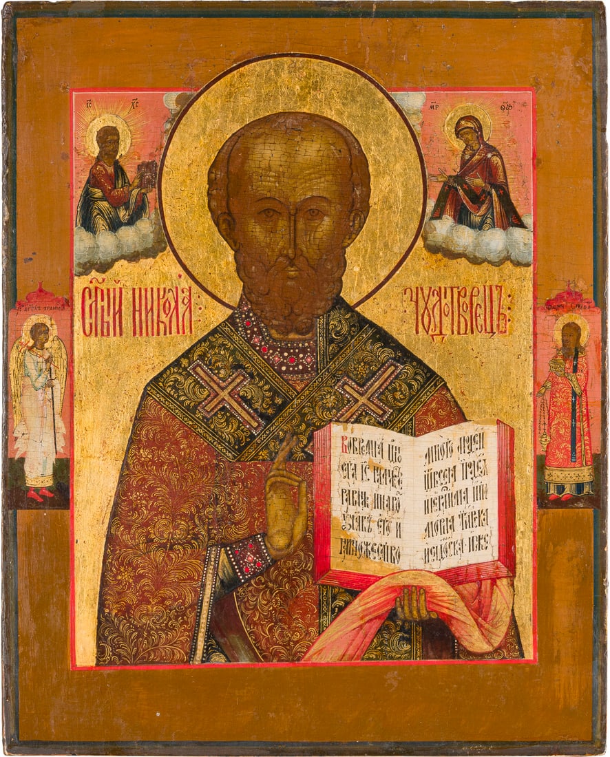 | IKONE MIT DEM HEILIGEN NIKOLAUS VON MYRA: AN ICON SHOWING ST. NICHOLAS OF MYRA Russian, circa 1800 Tempera on wood panel. The halo and background made of gold. Two selected saints on the borders: Guardian Angel and St. Stephen. Areas of resto