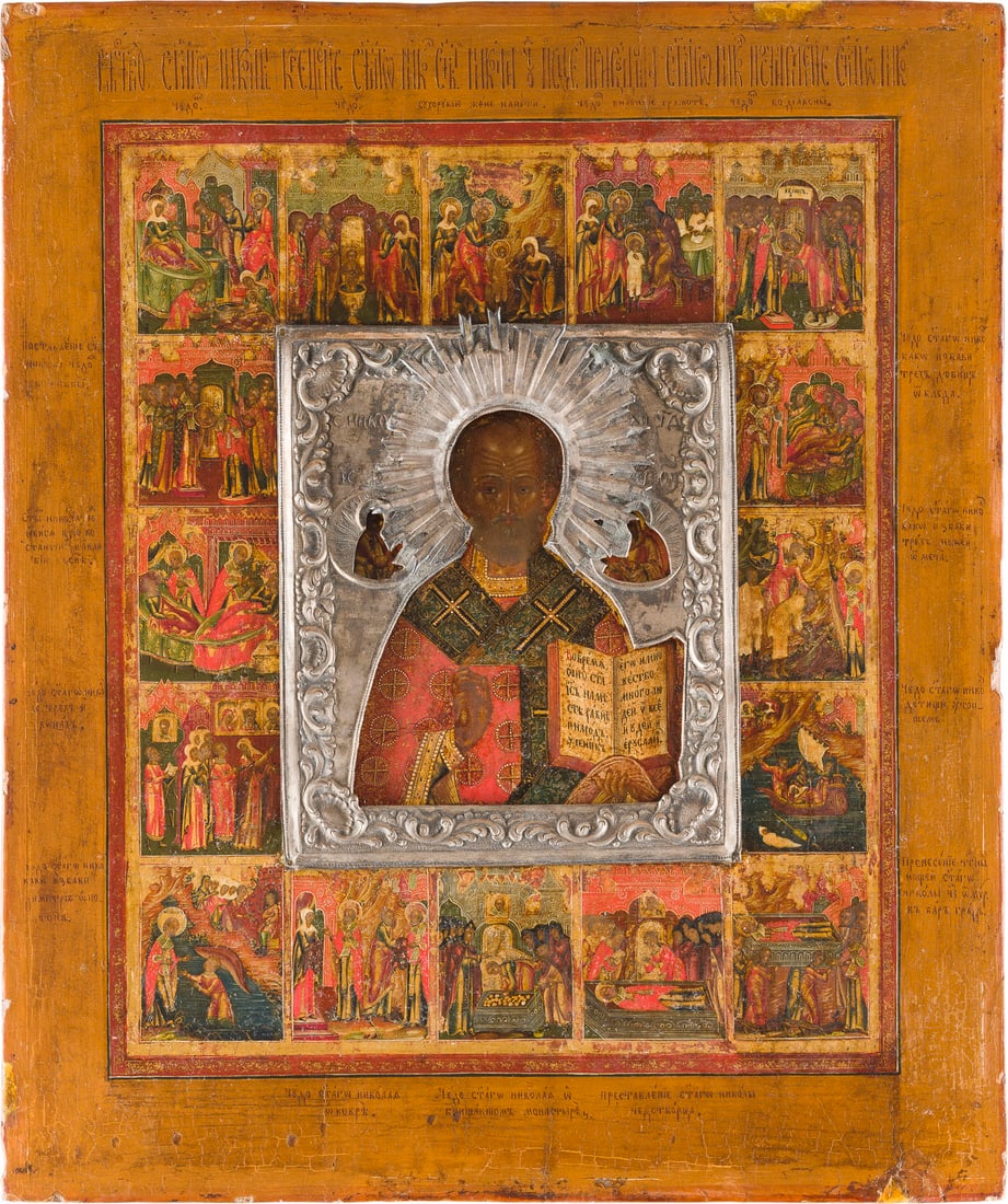 | SEHR FEINE VITA-IKONE MIT DEM HEILIGEN NIKOLAUS VON MYRA MIT SILBER-RIZA: A VERY FINE ICON SHOWING ST. NICHOLAS OF MYRA WITH 16 SCENES FROM HIS LIFE WITH SILVER RIZA Russland, Palech, 1. Haelfte 19. Jh. Russian, Palekh, 1st half of the 19th century Verbund zweier Bretter mi