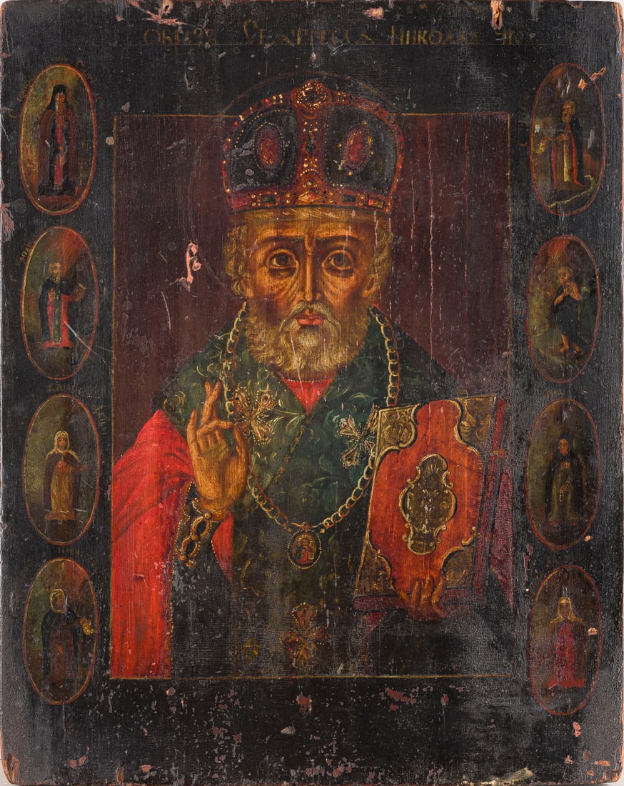 | IKONE MIT DEM HEILIGEN NIKOLAUS VON MYRA MIT ACHT RANDHEILIGEN: AN ICON SHOWING ST. NICHOLAS OF MYRA WITH EIGHT SELECTED SAINTS ON THE BORDERS Russian, late 18th century Oil on wood panel. Minor damages to the edges. 30.2 x 24.8 cm.IKONE MIT DEM HEILIGEN NIKOLAUS