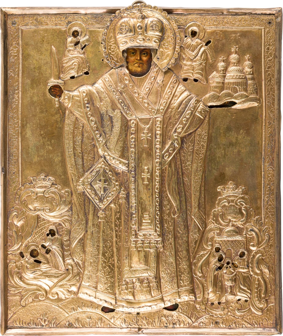 | IKONE MIT DEM HEILIGEN NIKOLAUS VON MOSCHAISK MIT ZWEI SZENEN SEINES LEBENS MIT OKLAD: AN ICON SHOWING ST. NICHOLAS OF MOZHAYSK WITH TWO SCENES FROM HIS LIFE WITH OKLAD Russian, 18th century Oil on wood panel. The brass oklad embossed and chased with scrolls. 32.2 x 27.6 cm.IKONE MIT DE
