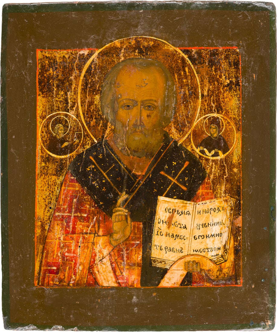 | IKONE MIT DEM HEILIGEN NIKOLAUS VON MYRA: AN ICON SHOWING ST. NICHOLAS OF MYRA Russian, circa 1800 Tempera on wood panel with kovcheg. The background made of silver, covered by a golden lacquer. Partially restored. 27.3 x 23.1 cm.IKONE MIT DE