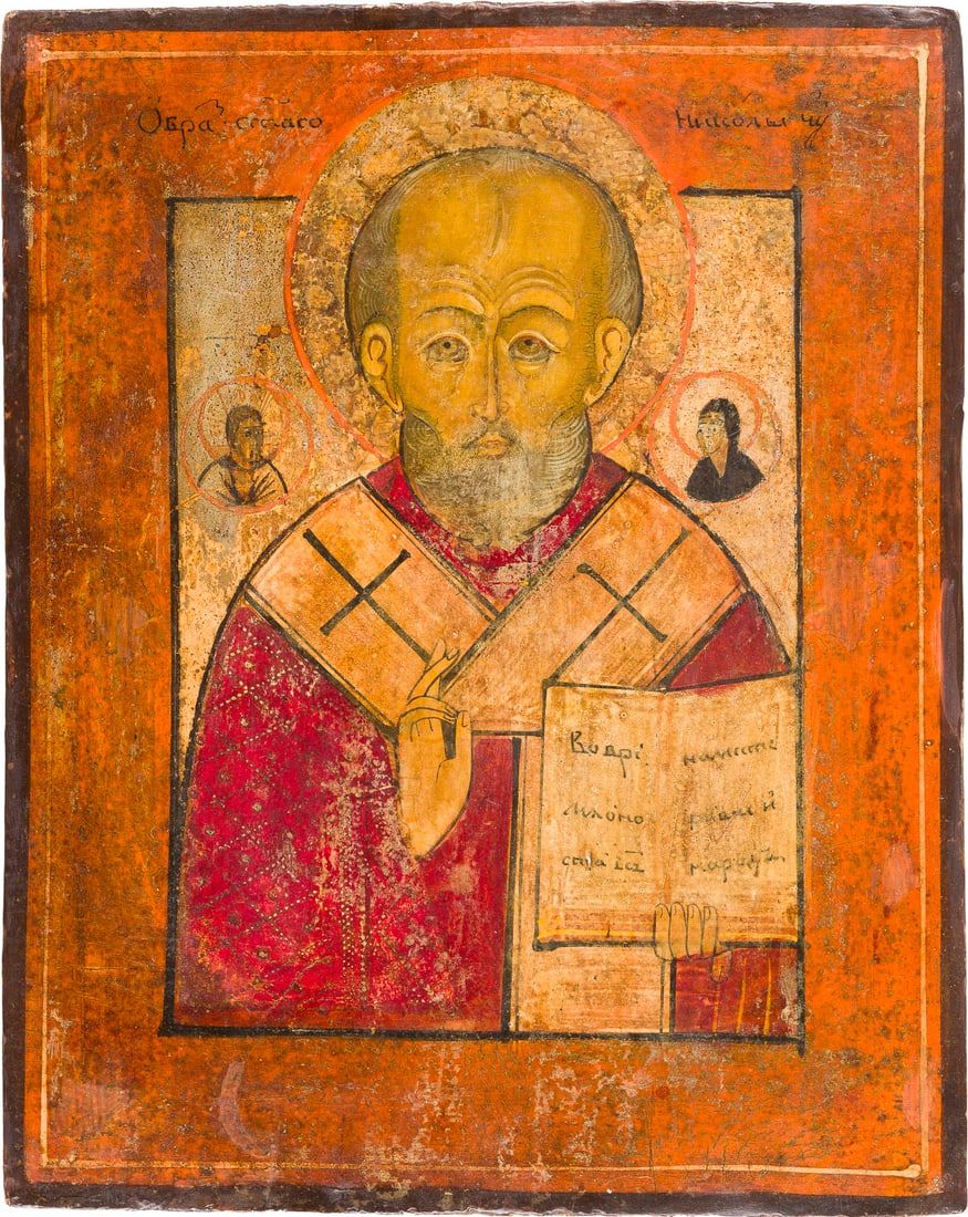 | KLEINE IKONE MIT DEM HEILIGEN NIKOLAUS VON MYRA: A SMALL ICON SHOWING ST. NICHOLAS OF MYRA Russian, 19th century Tempera on wood panel. The background and halo made of silver, covered by a golden lacquer. Wearings. 26.1 x 21.3 cm.KLEINE IKONE MIT DE