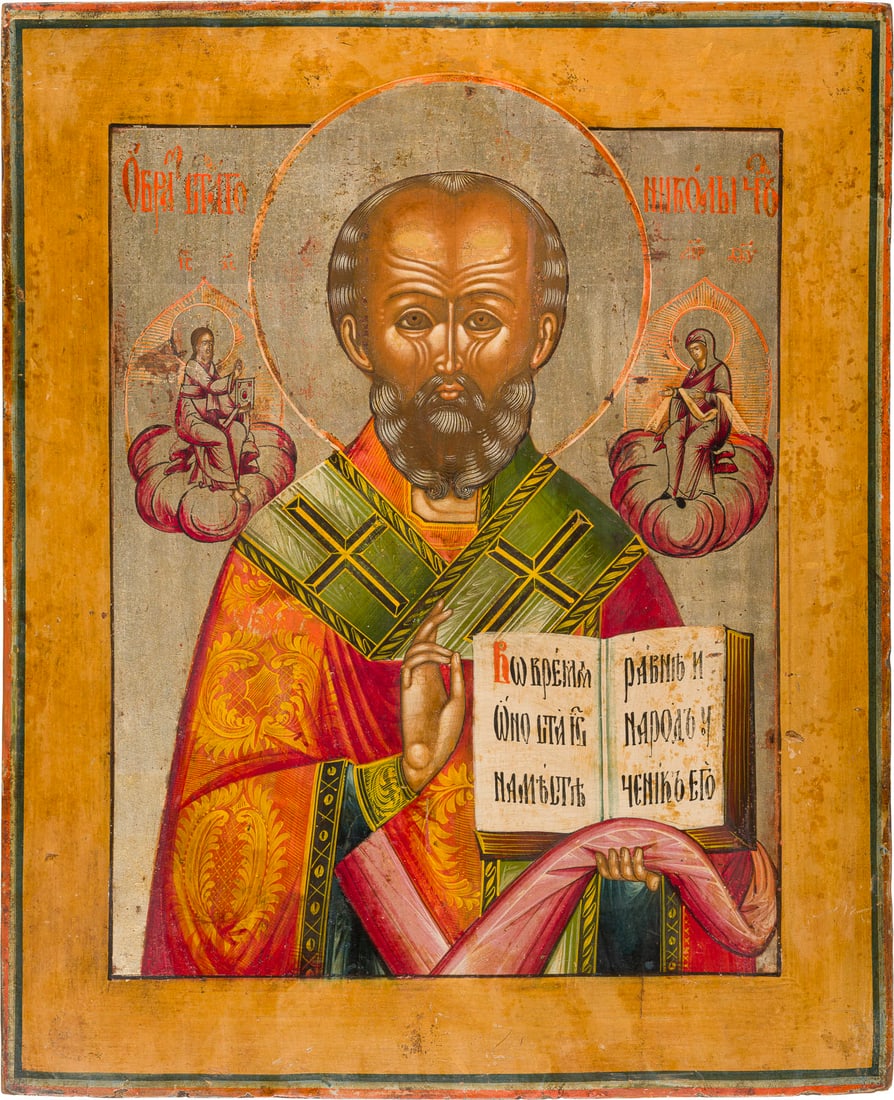 | GROSSFORMATIGE IKONE MIT DEM HEILIGEN NIKOLAUS VON MYRA: A LARGE ICON SHOWING ST. NICHOLAS OF MYRA Russian, circa 1800 Tempera on wood panel. The background made of silver, covered by a golden lacquer. Minor areas of retouching. 52.3 x 42.8 cm.GROSSFORMATIG