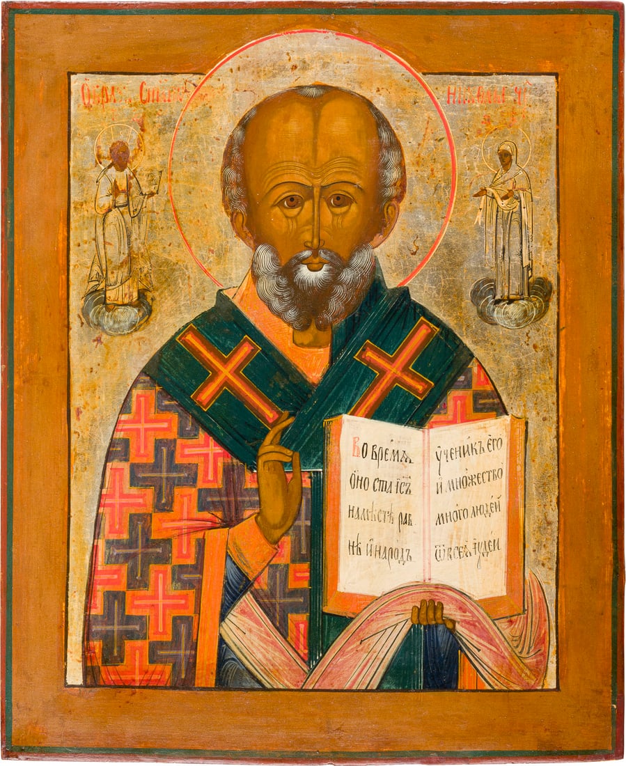 | GROSSFORMATIGE IKONE MIT DEM HEILIGEN NIKOLAUS VON MYRA: A LARGE ICON SHOWING ST. NICHOLAS OF MYRA Russian, 19th century Tempera on wood panel. The background made of silver, covered by a golden lacquer. Minor areas of retouching. 53 x 43.8 cm.GROSSFORMATIG