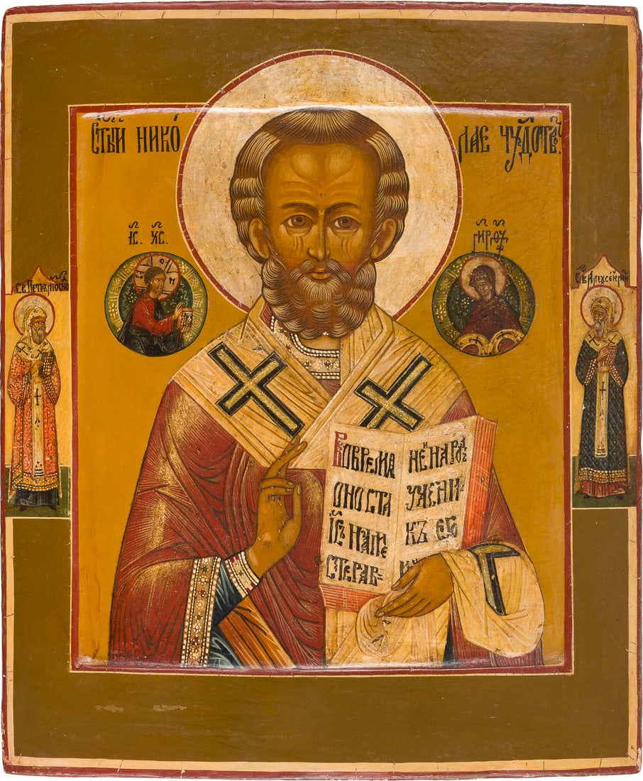 | KLEINE IKONE MIT DEM HEILIGEN NIKOLAUS VON MYRA: A SMALL ICON SHOWING ST. NICHOLAS OF MYRA Russian, late 19th century Tempera on wood panel with kovcheg. The haloes made of silver, covered by a golden lacquer. Two selected saints on the borders: Met