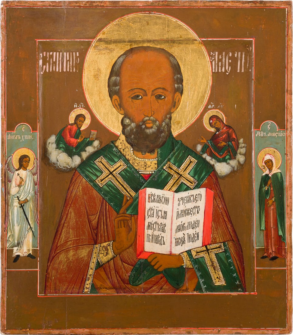 | IKONE MIT DEM HEILIGEN NIKOLAUS VON MYRA: AN ICON SHOWING ST. NICHOLAS OF MYRA Russian, circa 1880 Tempera on wood panel with kovcheg. The haloes made of gold. Two selected saints on the borders: Guardian Angel and St. Anastasya. Minor areas