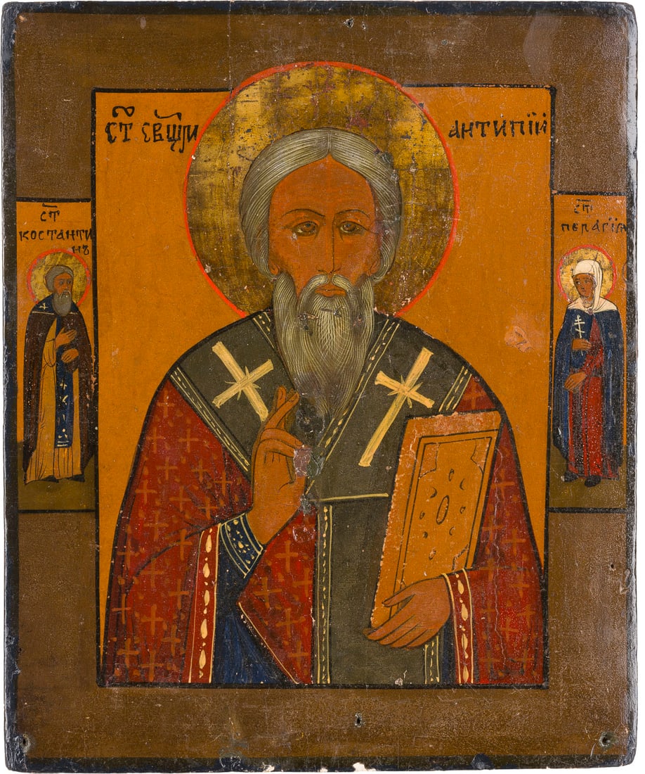 | KLEINE IKONE MIT DEM HEILIGEN ANTIPAS: A SMALL ICON SHOWING ST. ANTIPAS Russian, 19th century Tempera on wood panel. The haloes made of silver, covered by a golden lacquer. Two selected saints on the borders: a monk saint and St. Pelagia.