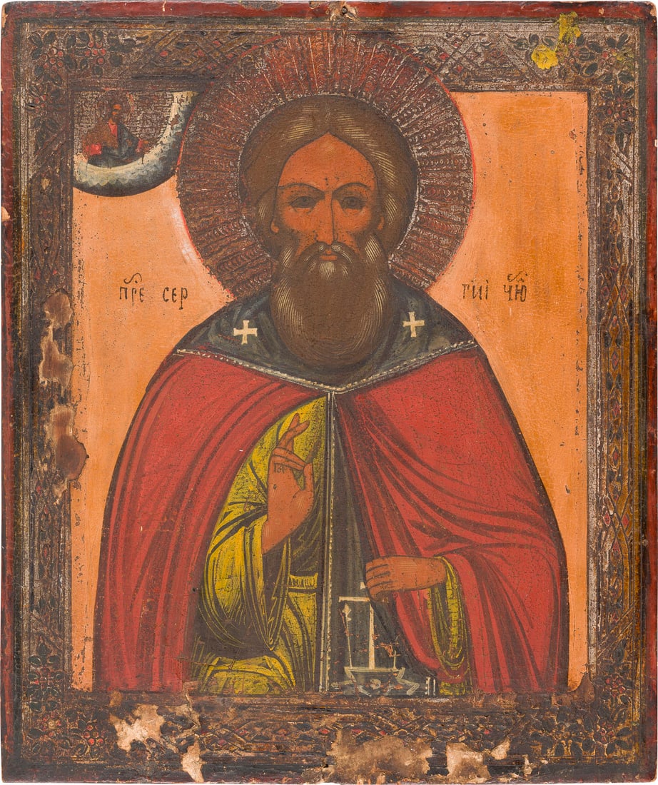 | IKONE MIT DEM HEILIGEN SERGEJ VON RADONESCH: AN ICON SHOWING ST. SERGEY OF RADONEZH Russian, late 19th century Tempera on wood panel. The border made of silver, emulating contemporary enamelwork. Losses to the borders. 30.5 x 26 cm.IKONE MIT DEM