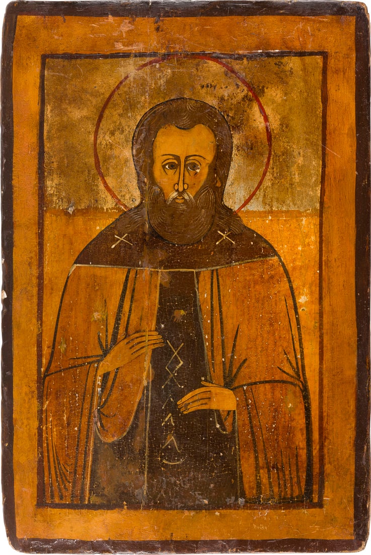| IKONE MIT EINEM MOeNCHSHEILIGEN: AN ICON DEPICTING A MONASTIC SAINT Russian, 19th century Tempera on wood panel. The background made of silver, covered by a golden lacquer. Vertical crack, restorations. 31.5 x 22 cm.IKONE MIT EINEM M