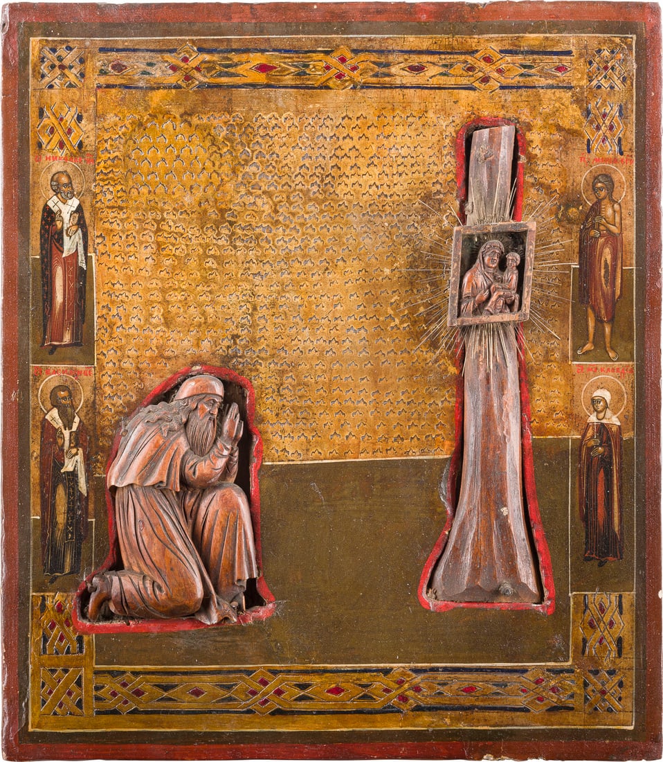 | SELTENE IKONE MIT DEM HEILIGEN DOROFEJ MIT DER GOTTESMUTTER 'JUGSKAJA': A RARE ICON SHOWING ST. DOROFEY AND THE JUGSKAYA MOTHER OF GOD Russian, circa 1800 (wood carving), Russian, late 19th century (icon) Carved in relief. Tempera on wood panel. The background made of sil