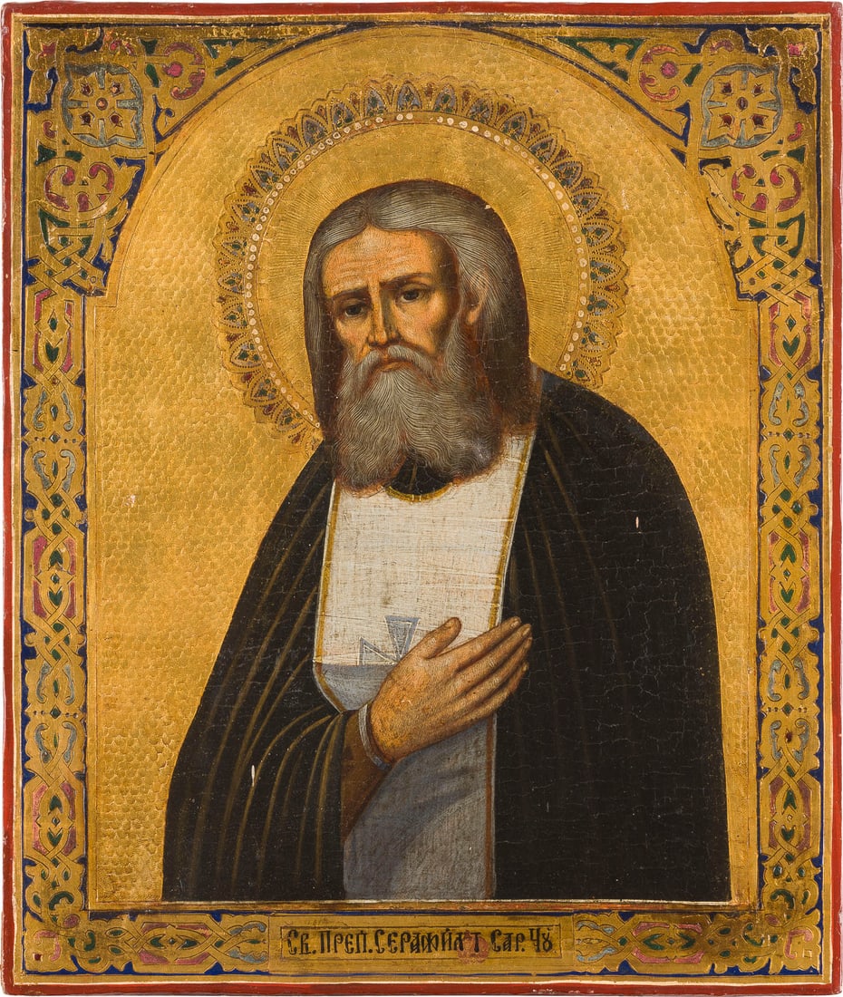 | IKONE MIT DEM HEILIGEN SERAFIM VON SAROW: AN ICON SHOWING ST. SERAPHIM OF SAROV Russian, after 1903 Tempera on wood panel. Executed delicately with ample gold against a punched background, the foliate border emulating contemporary enamelled d