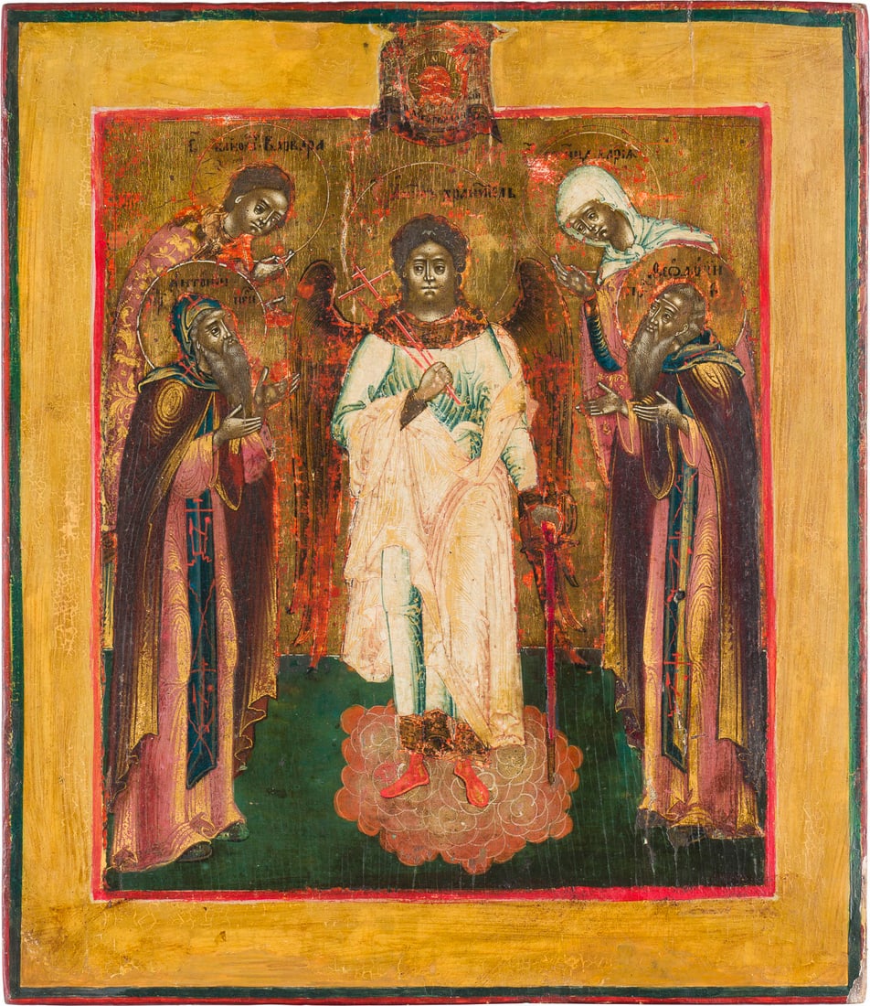 | FEINE IKONE MIT DEM SCHUTZENGEL FLANKIERT VON DEN HEILIGEN BARBARA, DARIA, ANTONIJ UND FEODOSIJ: A FINE ICON SHOWING THE GUARDIAN ANGEL FLANKED BY STS. BARBARA, DARIA, ANTONIY AND FEODOSIY OF THE KIEV CAVES Russian, 18th century Tempera on wood panel, with a gilded background and chrysography. Th