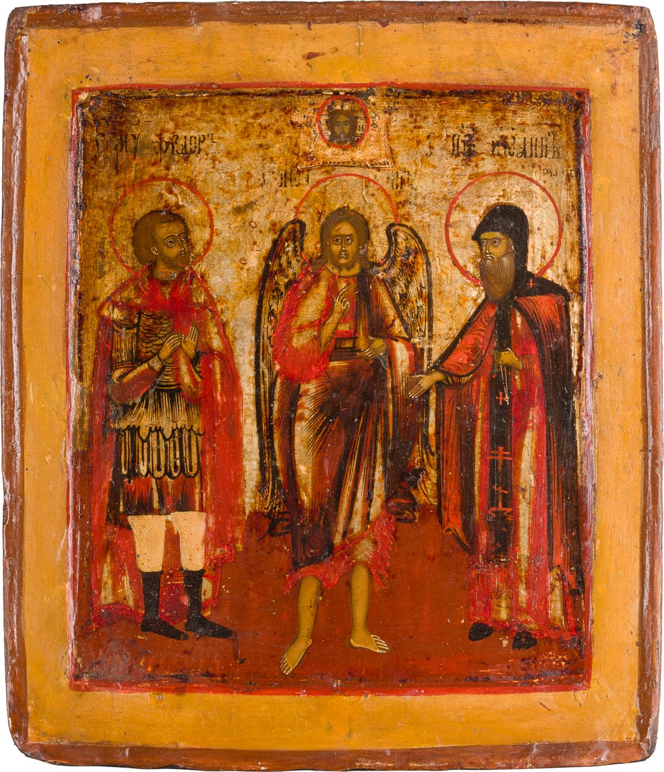 | NAMENSIKONE MIT DER WIEDERGABE DREI HEILIGER NAMENS JOHANNES: A NAME ICON DEPICTING THREE SAINTS NAMED JOHN Russian, 18th century Tempera on wood panel with double kovcheg. The background made of silver, covered by a golden lacquer. Partially restored. 31 x 26.8