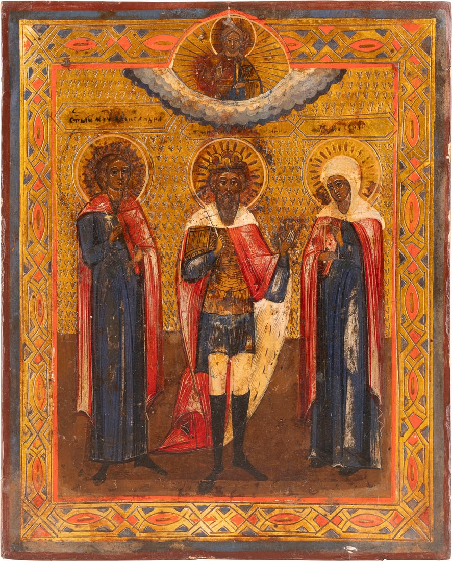 | IKONE MIT DREI HEILIGEN: AN ICON SHOWING THREE SELECTED SAINTS Russian, late 19th century Tempera on wood panel. The background made of silver, covered by a golden lacquer. The background ornately incised. The borders ornatel