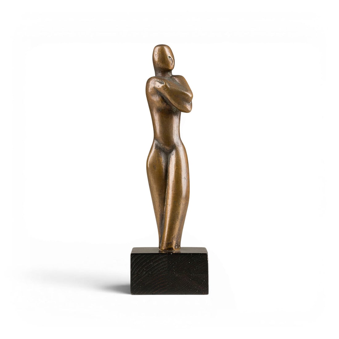 LEONORE GERBER-SPORLEDER | FRAUENAKT: LEONORE GERBER-SPORLEDER Herne 1912 - 2006 FEMALE NUDE Bronze, brown patinated, on wooden base. 23 x 7 x 6.2 cm, bronze 19 cm high. Total weight 1.4 kg. Monogr. 'GS' on the side.LEONORE GERBER-SPORLED