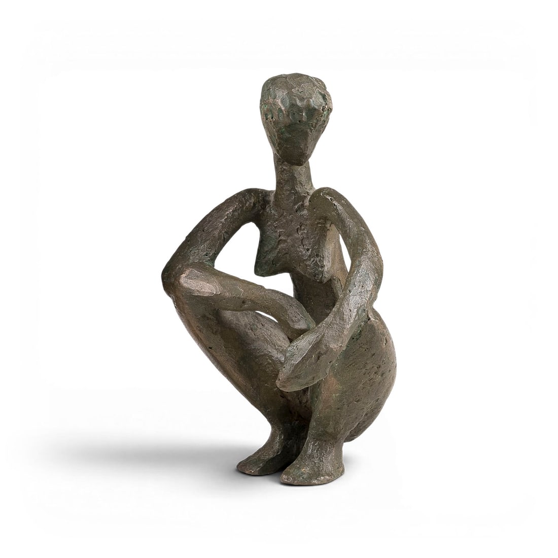 MAX KRATZ | 'HOCKENDE': MAX KRATZ 1921 Remscheid - 2000 Duesseldorf 'HOCKENDE (CROUCHING WOMAN)' Bronze, green-brown patinated. 13 x 8.5 x 9.5 cm. 714 g. With artists signet on the underside. Slight traces of oxidation.MAX K