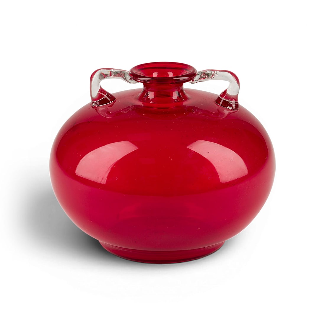 VITTORIO ZECCHIN | 'SOFFIATO' HENKELVASE: VITTORIO ZECCHIN 1878 Murano - 1947 ibid 'SOFFIATO' HANDLED VASE Murano, Venini & C., designed 1921-25 Colourless and ruby-red glass, bulbous shape w. applied handles. H. 11,5 cm, D. 15 cm. Marked und