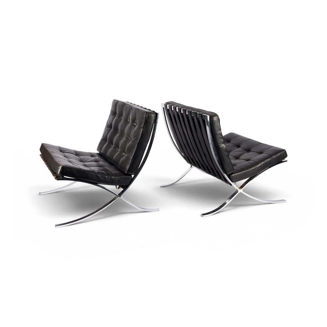 LUDWIG MIES VAN DER ROHE | PAAR SESSEL 'BARCELONA CHAIR': LUDWIG MIES VAN DER ROHE 1886 Aachen - 1969 Chicago PAIR OF 'BARCELONA CHAIRS' Knoll International / Gavina, 1970s version Chrome-plated flat steel, upholstered cushions, straps and cover in black lea