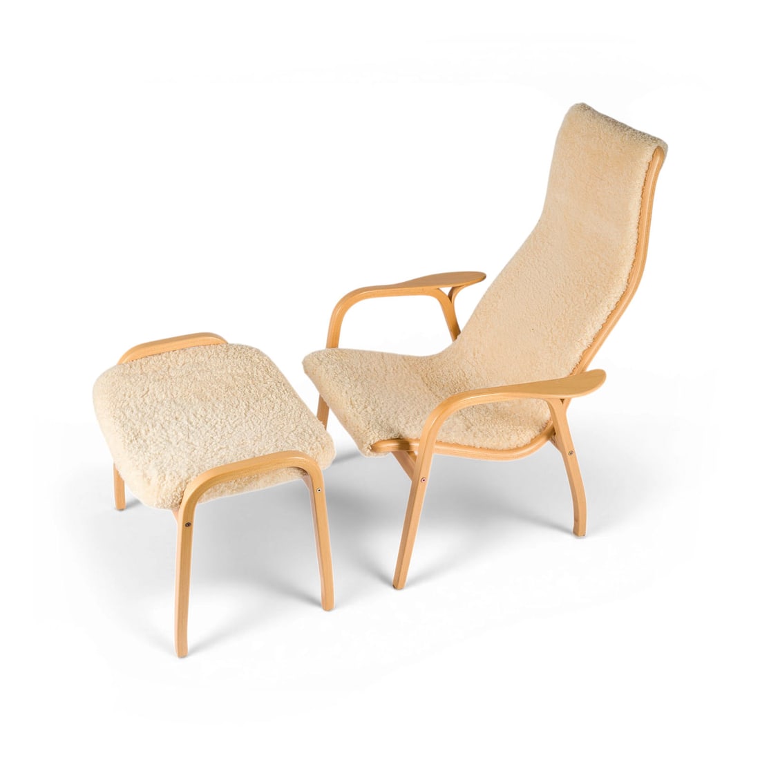 YNGVE EKSTROEM | SESSEL 'LAMINO' MIT HOCKER: YNGVE EKSTROEM 1913 Hagafors - 1988 Vaggeryd, Sweden A 'LAMINO' ARMCHAIR WITH FOOTSTOOL Sweden, Swedese Mobler, designed in 1956, ed. 2007 Laminated beech wood, linen fabric, cream-coloured lambskin. 
